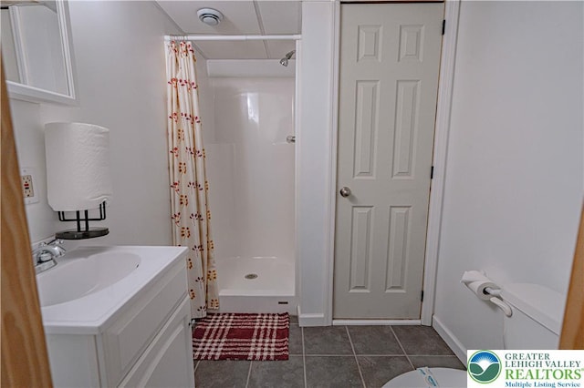 379 Meyer Rd, Bushkill Twp, PA 18064 - full bathroom with tile patterned floors, a shower stall, and vanity