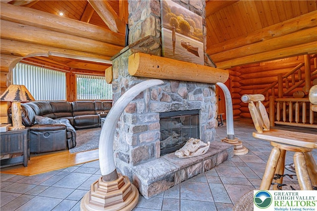379 Meyer Rd, Bushkill Twp, PA 18064 - living room featuring a wood ceiling with exposed beams, a fireplace, log walls, and high vaulted ceiling