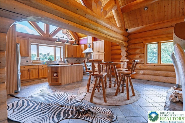 379 Meyer Rd, Bushkill Twp, PA 18064 - dining room with wood ceiling, plenty of natural light, and log walls