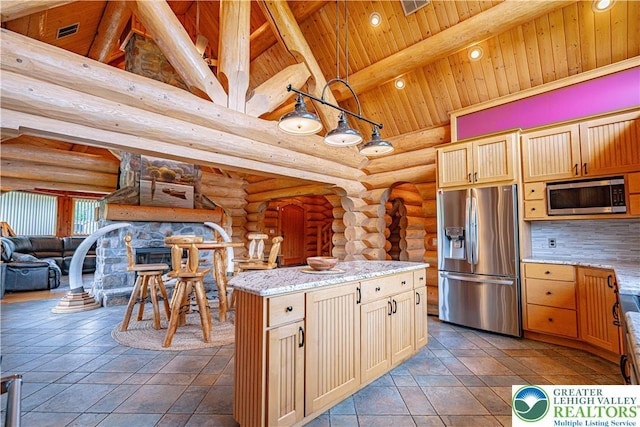 379 Meyer Rd, Bushkill Twp, PA 18064 - kitchen with stainless steel appliances, a wooden ceiling with exposed beams, log walls, high vaulted ceiling, and light stone counters