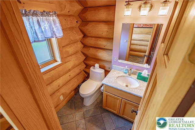 379 Meyer Rd, Bushkill Twp, PA 18064 - bathroom with rustic walls, vanity, and tile patterned floors