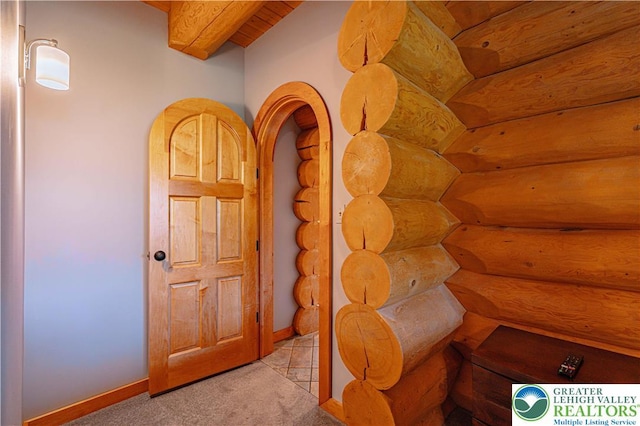 379 Meyer Rd, Bushkill Twp, PA 18064 - hallway with rustic walls and carpet flooring