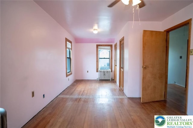815 Summit Ave, Prospect Park, PA 19076 - spare room with radiator heating unit, a ceiling fan, and wood finished floors