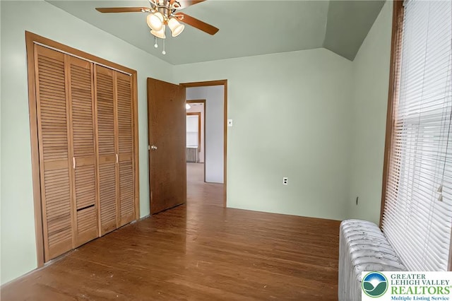 815 Summit Ave, Prospect Park, PA 19076 - unfurnished bedroom with wood finished floors, vaulted ceiling, a closet, ceiling fan, and radiator heating unit