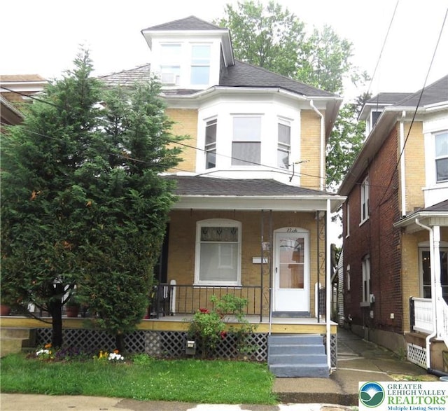 2206 Forest St, Wilson Boro, PA 18042 - american foursquare style home featuring a porch and a shingled roof