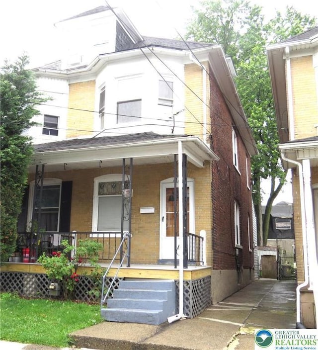 2206 Forest St, Wilson Boro, PA 18042 - view of front of home with brick siding and a porch