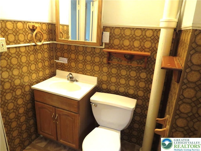 2206 Forest St, Wilson Boro, PA 18042 - bathroom featuring tile walls, vanity, and a wainscoted wall