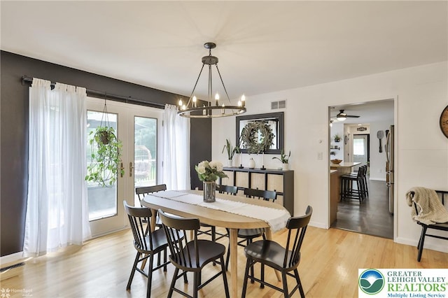 1925 Peach Tree Ln, Lower Saucon Twp, PA 18015 - dining area featuring plenty of natural light, a chandelier, light wood-style floors, and french doors