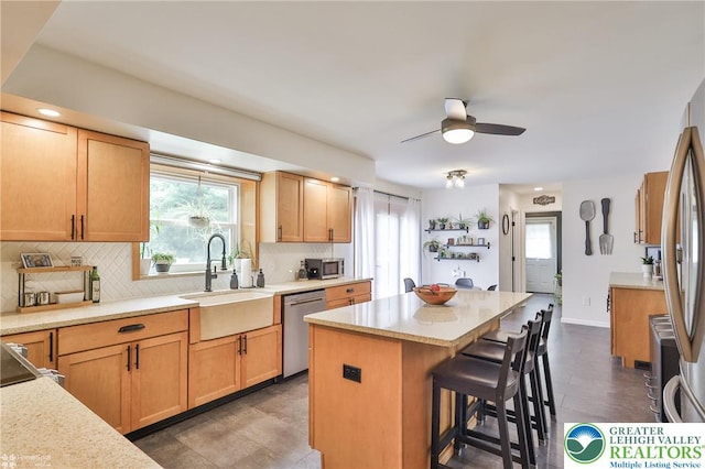 1925 Peach Tree Ln, Lower Saucon Twp, PA 18015 - kitchen with appliances with stainless steel finishes, a center island, tasteful backsplash, a kitchen bar, and recessed lighting
