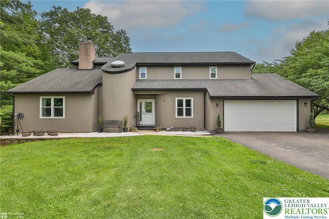1925 Peach Tree Ln, Lower Saucon Twp, PA 18015 - view of front of home featuring a chimney, asphalt driveway, an attached garage, a front yard, and a shingled roof
