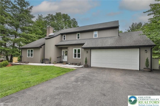 1925 Peach Tree Ln, Lower Saucon Twp, PA 18015 - view of front of home with a chimney, driveway, roof with shingles, a garage, and a front yard