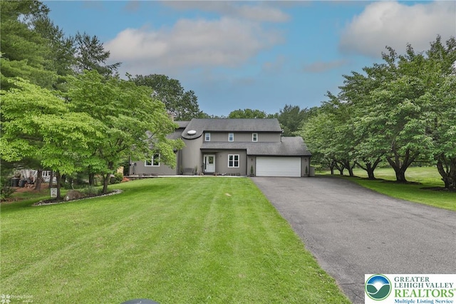 1925 Peach Tree Ln, Lower Saucon Twp, PA 18015 - view of front of property featuring asphalt driveway, an attached garage, a front lawn, and stucco siding