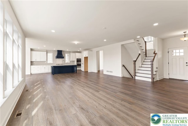1901 Meadows Rd, Lower Saucon Twp, PA 18015 - unfurnished living room featuring dark wood finished floors, recessed lighting, and stairs