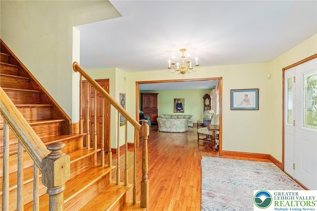 1151 Marfield Dr, Bushkill Twp, PA 18064 - foyer with a chandelier, wood finished floors, and stairway