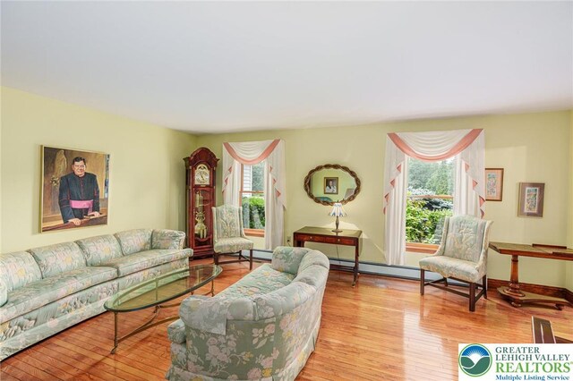 1151 Marfield Dr, Bushkill Twp, PA 18064 - living room featuring wood finished floors and a baseboard radiator