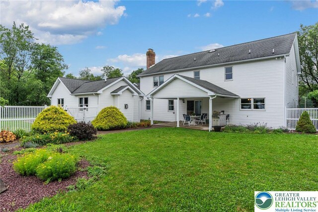 1151 Marfield Dr, Bushkill Twp, PA 18064 - rear view of house with a patio and a chimney