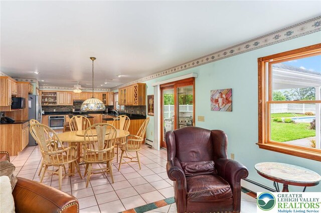 1151 Marfield Dr, Bushkill Twp, PA 18064 - dining room featuring plenty of natural light, light tile patterned floors, baseboard heating, and recessed lighting