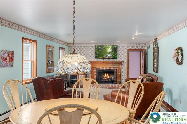 1151 Marfield Dr, Bushkill Twp, PA 18064 - dining room featuring a fireplace, wallpapered walls, and baseboard heating