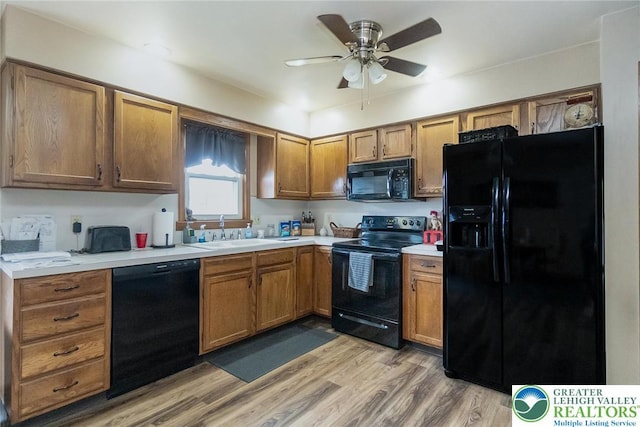 468 E 9th St, Northampton Boro, PA 18067 - kitchen with black appliances, light countertops, a ceiling fan, and brown cabinetry
