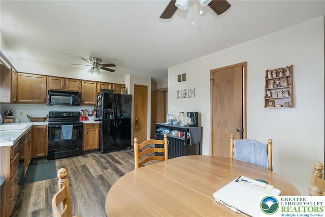 468 E 9th St, Northampton Boro, PA 18067 - kitchen with black appliances, ceiling fan, light wood-style floors, and light countertops