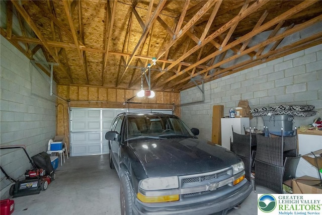 468 E 9th St, Northampton Boro, PA 18067 - garage with a garage door opener and concrete block wall