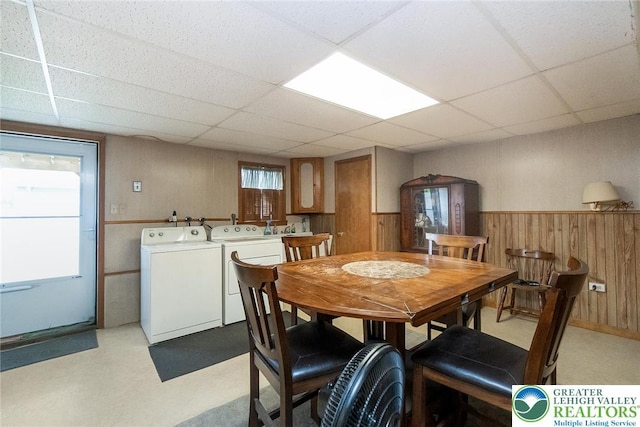 468 E 9th St, Northampton Boro, PA 18067 - dining room featuring a drop ceiling, wood walls, a wainscoted wall, light floors, and independent washer and dryer