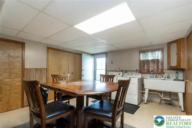 468 E 9th St, Northampton Boro, PA 18067 - dining room with a paneled ceiling, healthy amount of natural light, a wainscoted wall, wood walls, and washer and clothes dryer