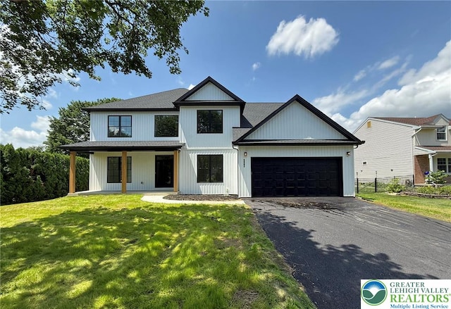 3631 Oak Ridge Dr, Washington Twp, PA 18080 - modern farmhouse with asphalt driveway and an attached garage
