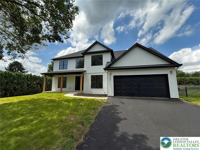 3631 Oak Ridge Dr, Washington Twp, PA 18080 - modern inspired farmhouse featuring driveway, a garage, and a porch