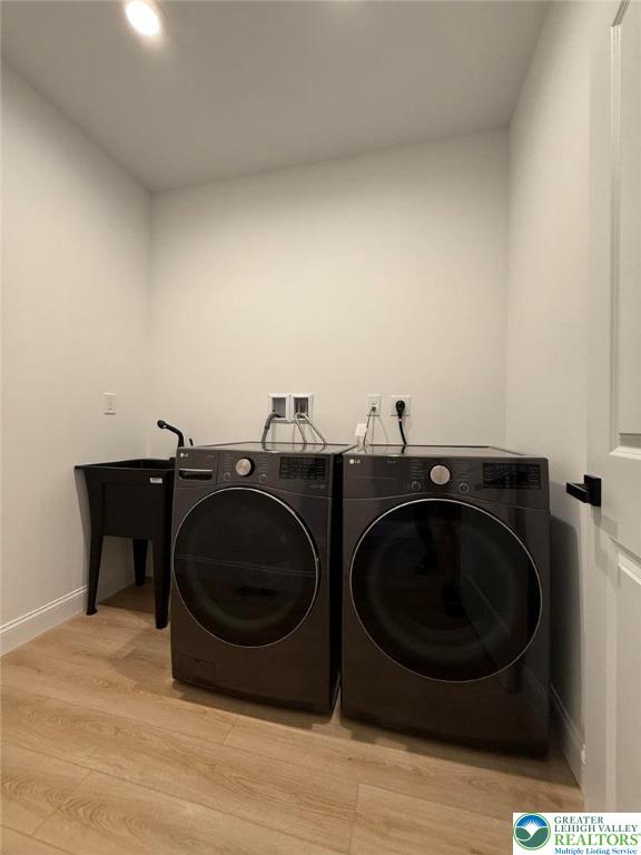 3631 Oak Ridge Dr, Washington Twp, PA 18080 - laundry area featuring washer and dryer, light wood-style floors, and recessed lighting