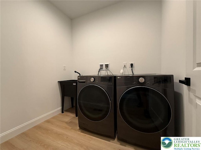 3631 Oak Ridge Dr, Washington Twp, PA 18080 - laundry room with washing machine and dryer and light wood-type flooring