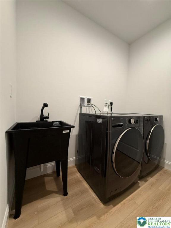 3631 Oak Ridge Dr, Washington Twp, PA 18080 - laundry room featuring separate washer and dryer and light wood-style flooring