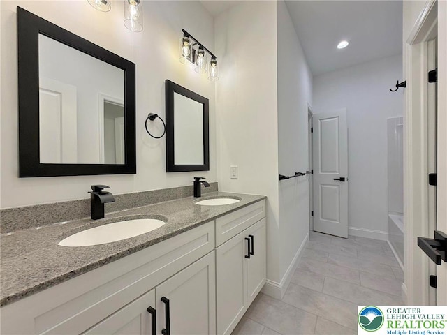 3631 Oak Ridge Dr, Washington Twp, PA 18080 - full bathroom featuring double vanity, marble look tiles, and  shower combination