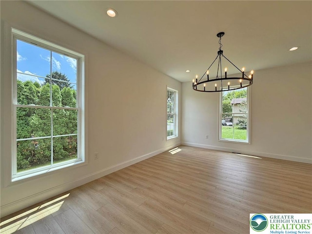 3631 Oak Ridge Dr, Washington Twp, PA 18080 - empty room with a chandelier, healthy amount of natural light, light wood finished floors, and recessed lighting