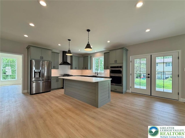 3631 Oak Ridge Dr, Washington Twp, PA 18080 - kitchen featuring appliances with stainless steel finishes, gray cabinetry, wall chimney exhaust hood, light countertops, and recessed lighting