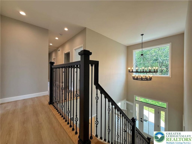 3631 Oak Ridge Dr, Washington Twp, PA 18080 - staircase featuring a chandelier, healthy amount of natural light, wood finished floors, and recessed lighting