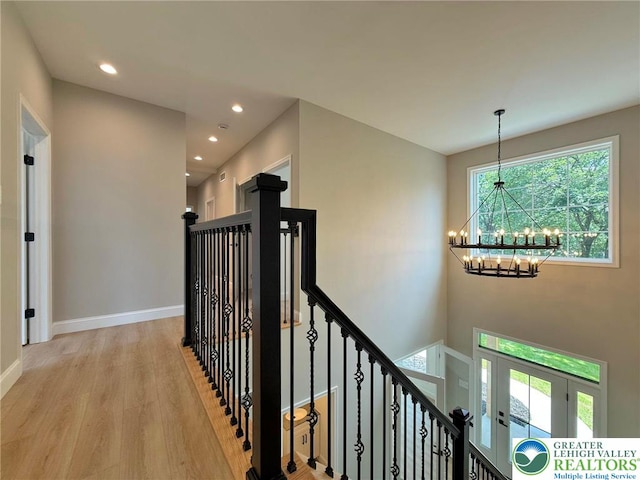 3631 Oak Ridge Dr, Washington Twp, PA 18080 - hall with a chandelier, wood finished floors, recessed lighting, and an upstairs landing