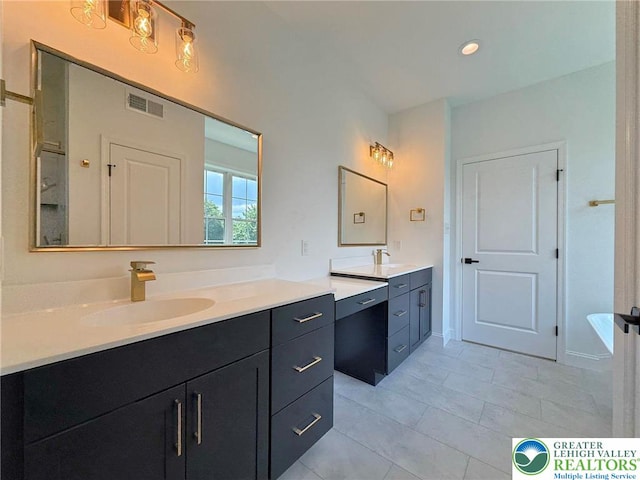 3631 Oak Ridge Dr, Washington Twp, PA 18080 - full bathroom featuring vanity, a bathtub, tile patterned floors, and recessed lighting