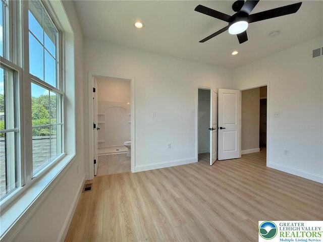 3631 Oak Ridge Dr, Washington Twp, PA 18080 - unfurnished bedroom with light wood-type flooring, ensuite bathroom, recessed lighting, ceiling fan, and a spacious closet
