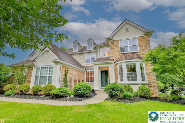 780 Ramblewood Dr, Forks Twp, PA 18040 - view of front of home featuring stone siding and a front yard