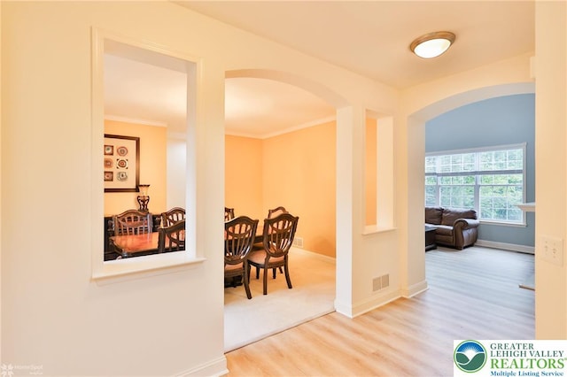 780 Ramblewood Dr, Forks Twp, PA 18040 - corridor featuring arched walkways, wood finished floors, and crown molding