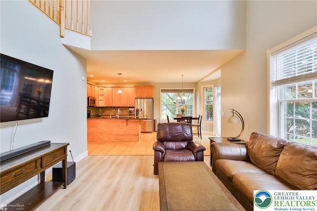 780 Ramblewood Dr, Forks Twp, PA 18040 - living area with light wood-type flooring and a high ceiling