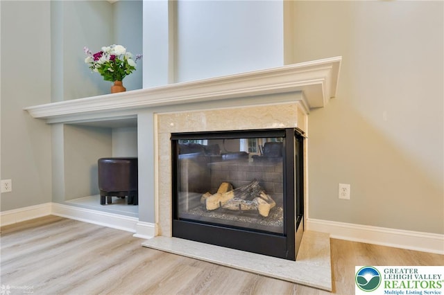 780 Ramblewood Dr, Forks Twp, PA 18040 - detailed view of a glass covered fireplace and wood finished floors