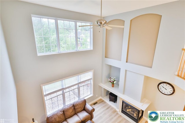 780 Ramblewood Dr, Forks Twp, PA 18040 - living area featuring wood finished floors, ceiling fan, and a high ceiling