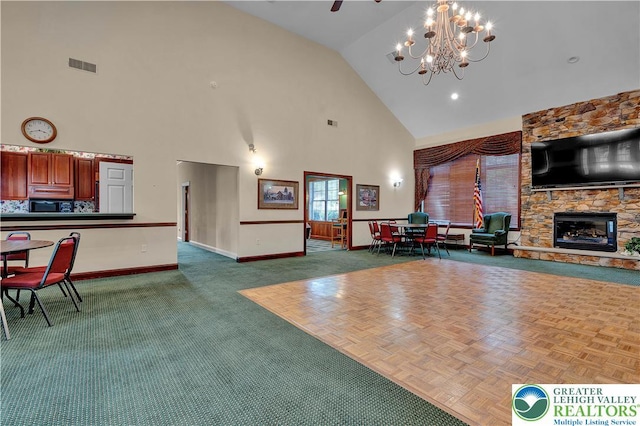 4693 Bluegrass Ln, Lower Macungie Twp, PA 18062 - living room featuring high vaulted ceiling, a chandelier, and a fireplace