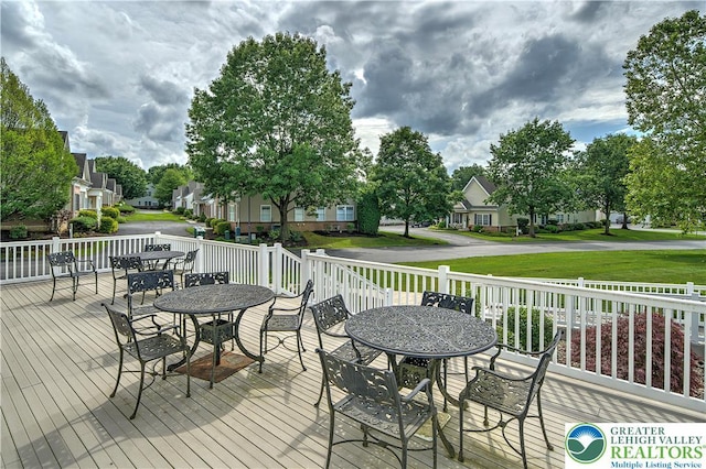 4693 Bluegrass Ln, Lower Macungie Twp, PA 18062 - wooden deck featuring outdoor dining space and a residential view