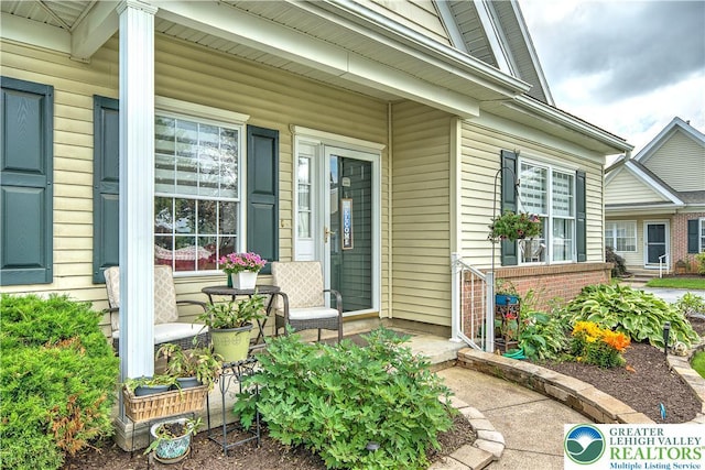4693 Bluegrass Ln, Lower Macungie Twp, PA 18062 - property entrance featuring a porch and brick siding