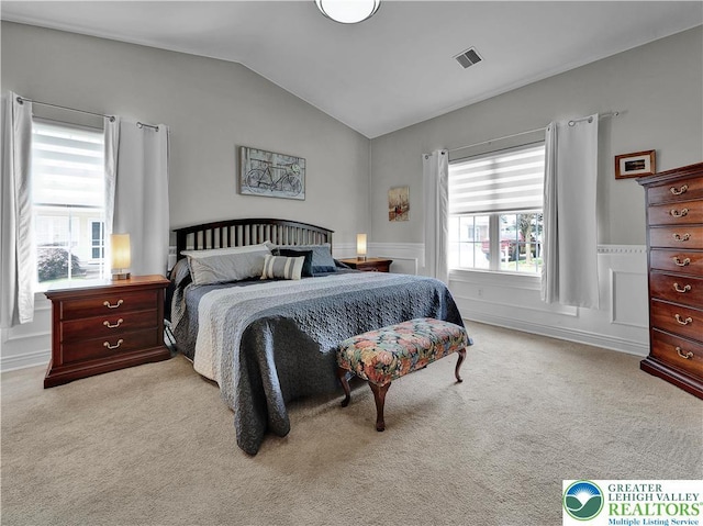 4693 Bluegrass Ln, Lower Macungie Twp, PA 18062 - bedroom featuring lofted ceiling, carpet, and wainscoting