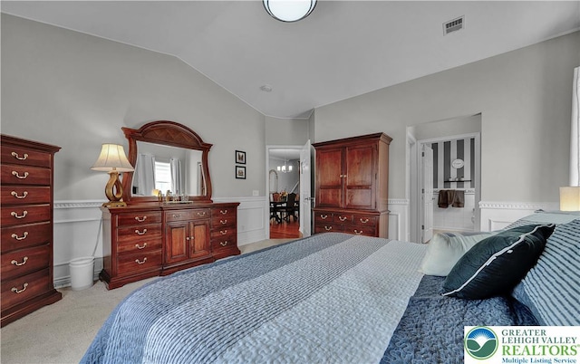 4693 Bluegrass Ln, Lower Macungie Twp, PA 18062 - bedroom featuring carpet flooring, a wainscoted wall, lofted ceiling, and a decorative wall