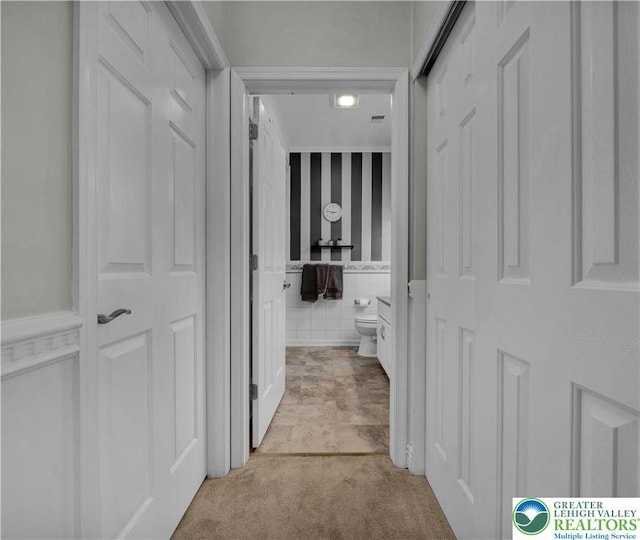 4693 Bluegrass Ln, Lower Macungie Twp, PA 18062 - corridor featuring wainscoting and light colored carpet